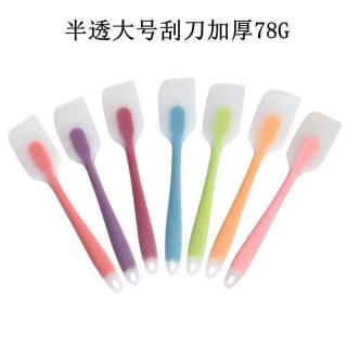 Thickened transparent silicone spatula for baking, used to scrape cream and meringue, as a cake baking tool